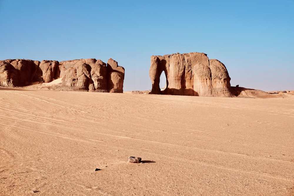 a rock formation in the middle of a desert