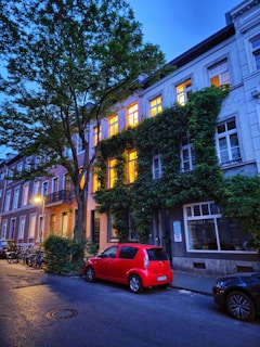Evergreen Plumbing Solutions van parked outside a charming Parisian townhouse at dusk.