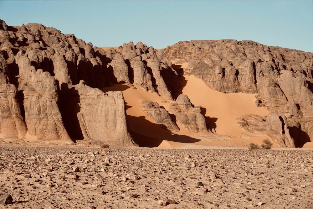 a desert landscape with rocks and sand