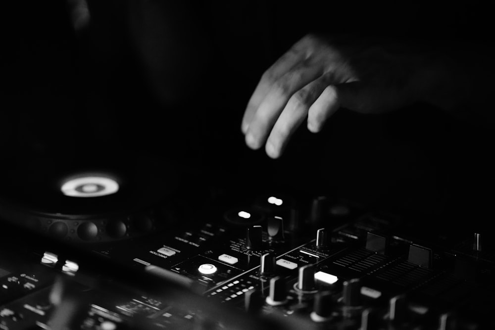 a dj mixing a track with his hands