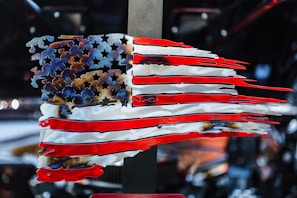 A cracked American flag symbolizing the fragile state of democracy.