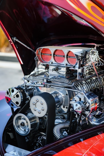 A close-up of various car engine parts arranged neatly.