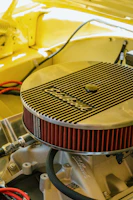 A variety of colorful automotive filters displayed on a wooden surface
