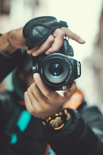 A close-up of a camera focused on a storyteller's hands.