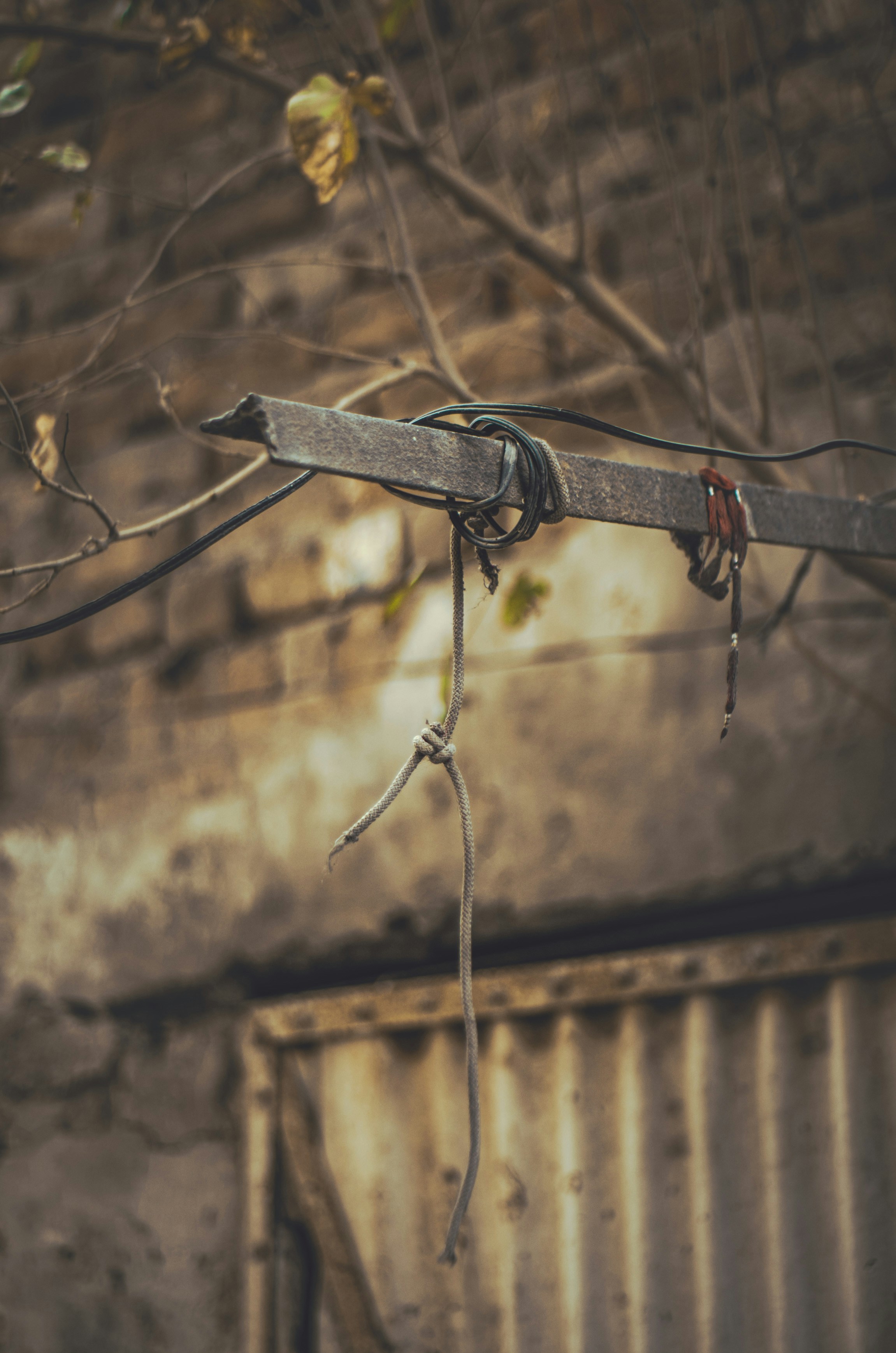 a pair of scissors hanging from a wire