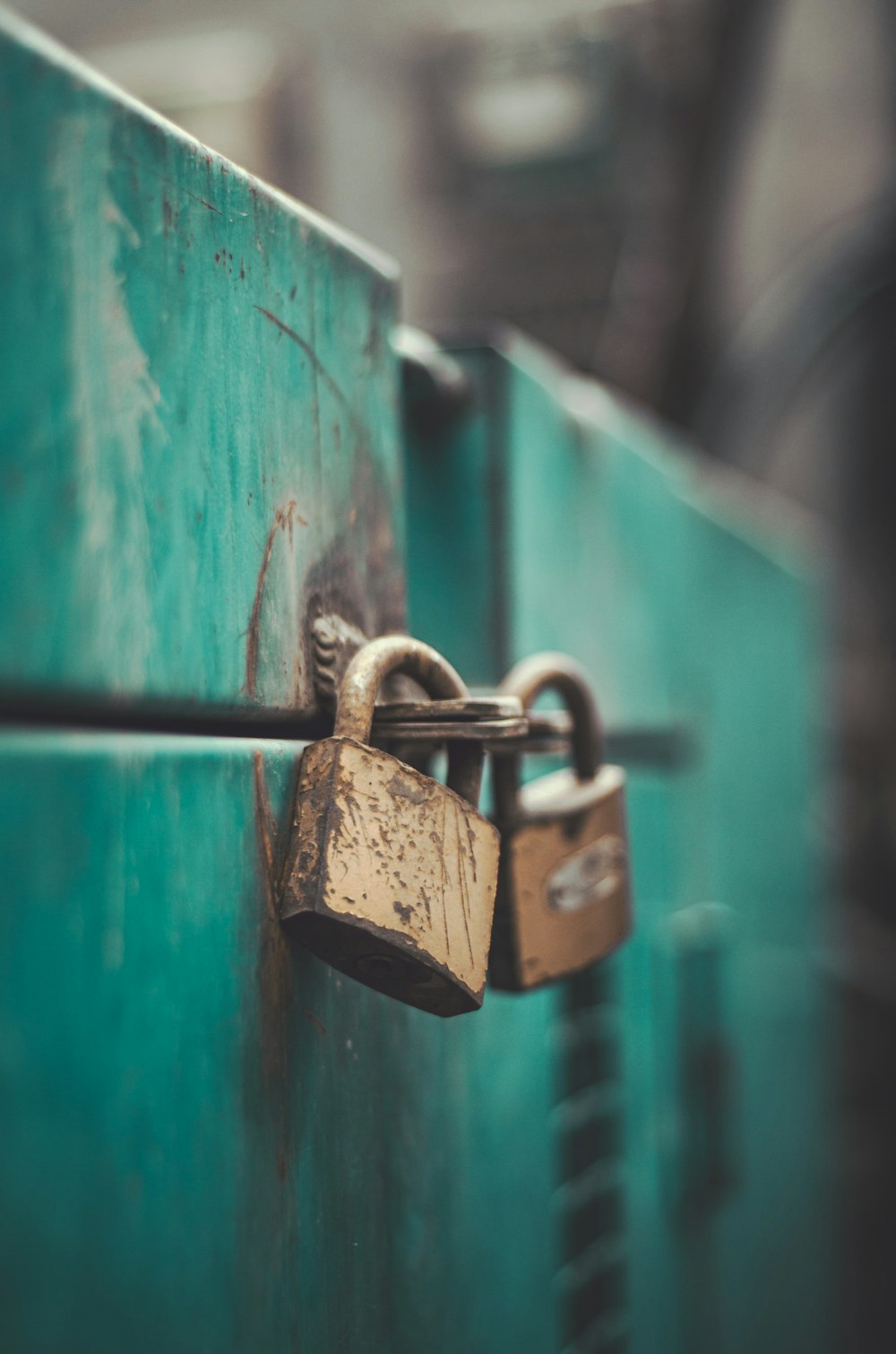 a close up of a padlock on a green door