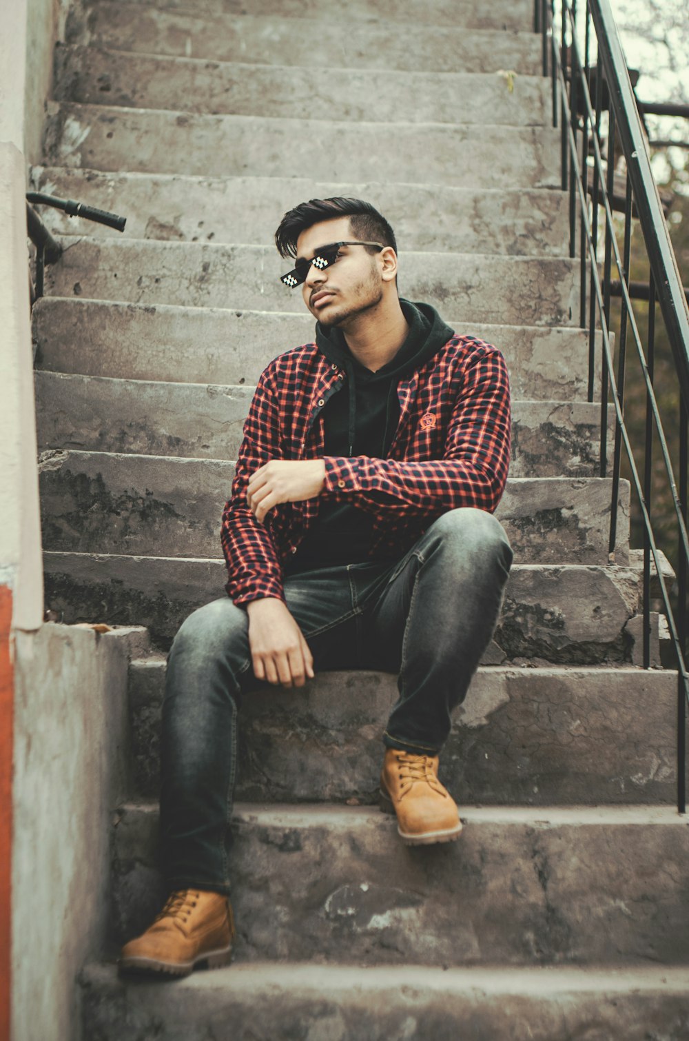 a man sitting on a set of stairs