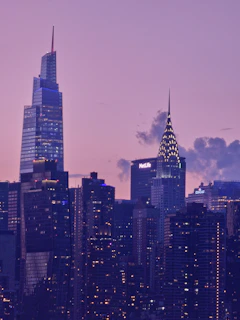Evening view of Sai Skyline Infra’s residential towers glowing warmly against the Udaipur skyline.