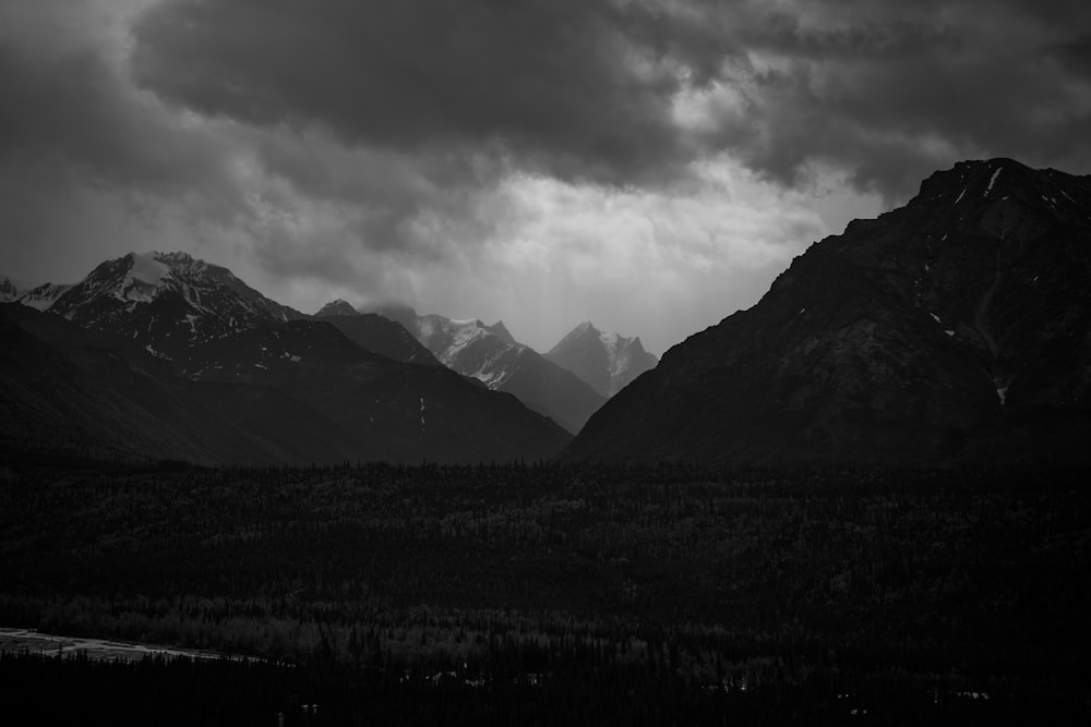 a black and white photo of a mountain range