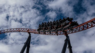 Close-up of a thrilling coaster loop with riders screaming in excitement.