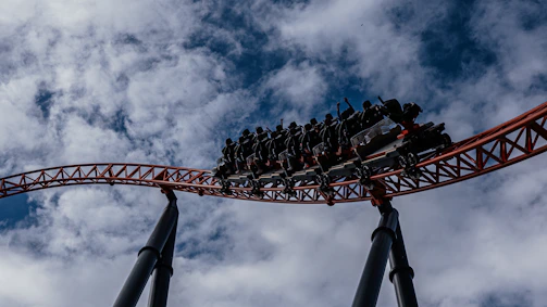 Close-up of a thrilling coaster loop with riders screaming in excitement.