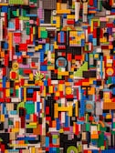 A vibrant display of various Lego sets arranged artistically.