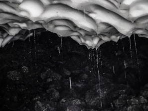 Dark and moody Minecraft cave texture with glowing crystals and rough stone surfaces.