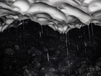 Dark and moody Minecraft cave texture with glowing crystals and rough stone surfaces.