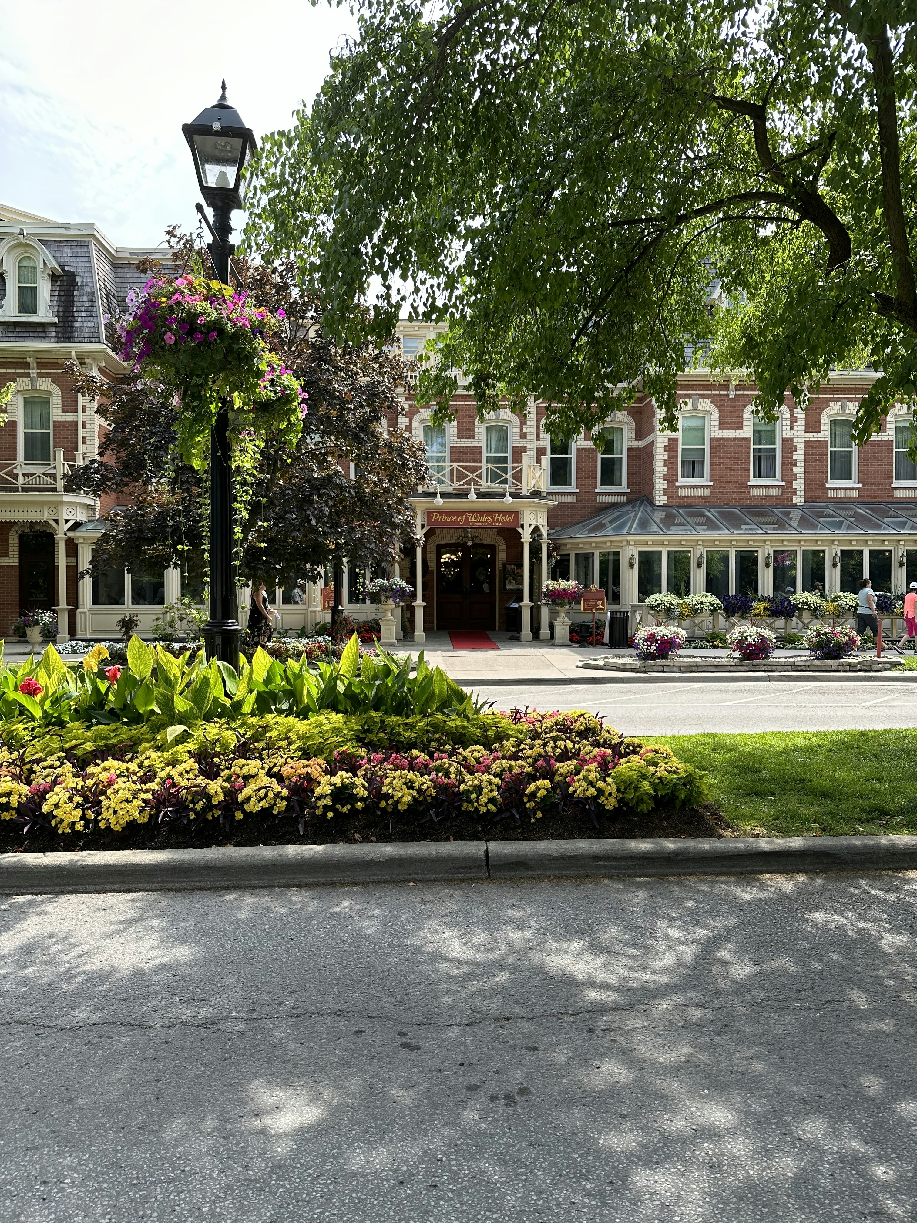 a lamp post in front of a large brick building
