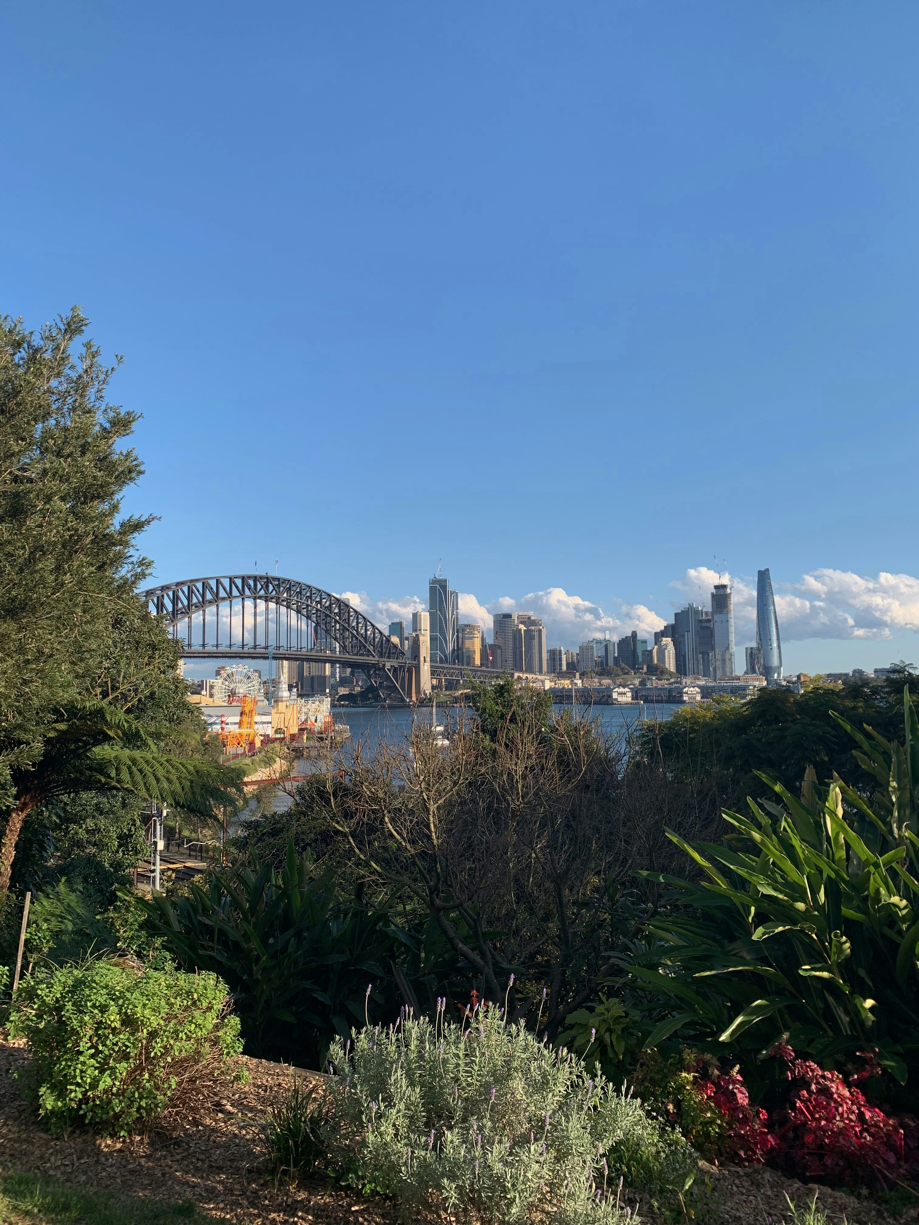 a view of a city and a bridge over water