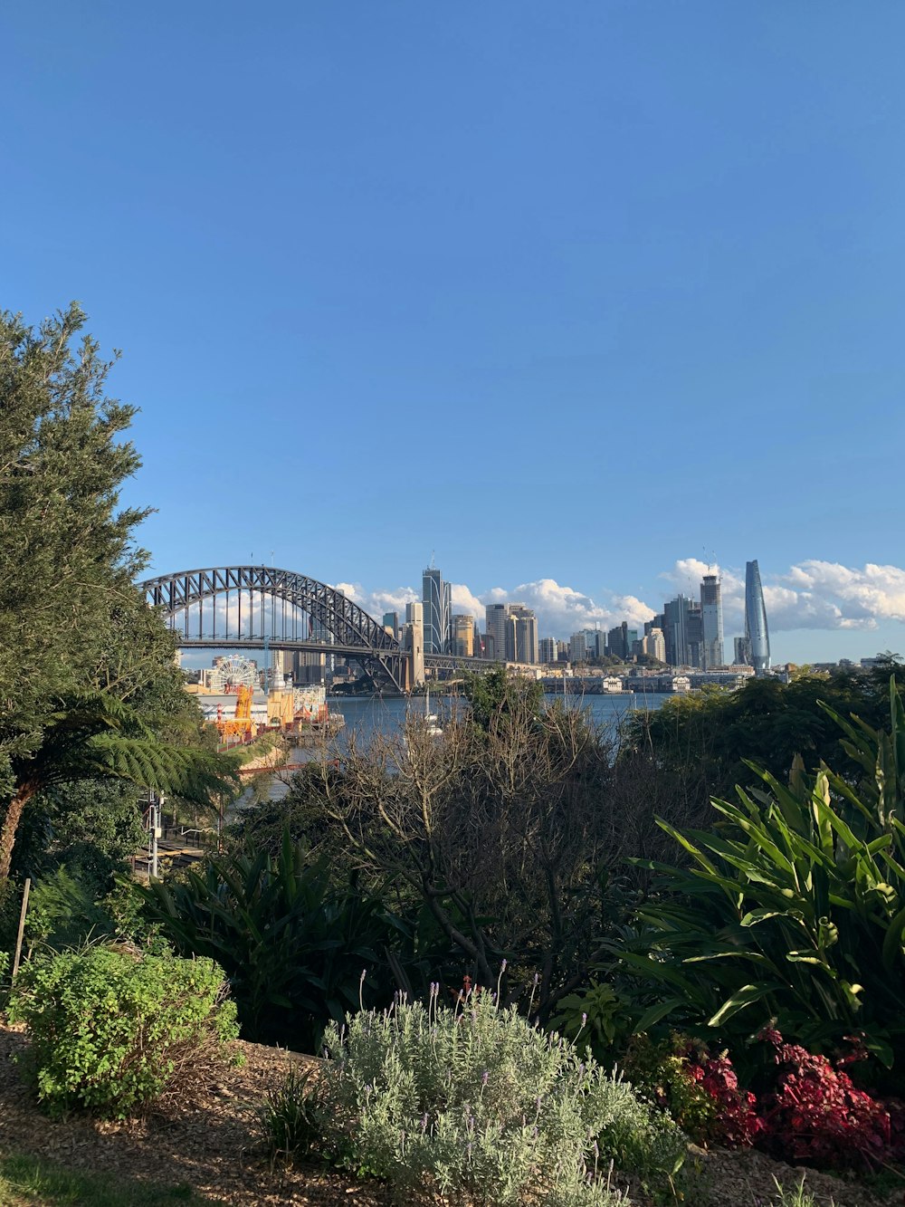 a view of a city and a bridge over water