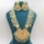 An ornate necklace set displayed on a teal jewelry bust. The necklace features intricate gold designs with multiple strands of pale green beads and elaborate gold ornaments. It is accompanied by matching earrings that share the same gold detailing and dangling beads.