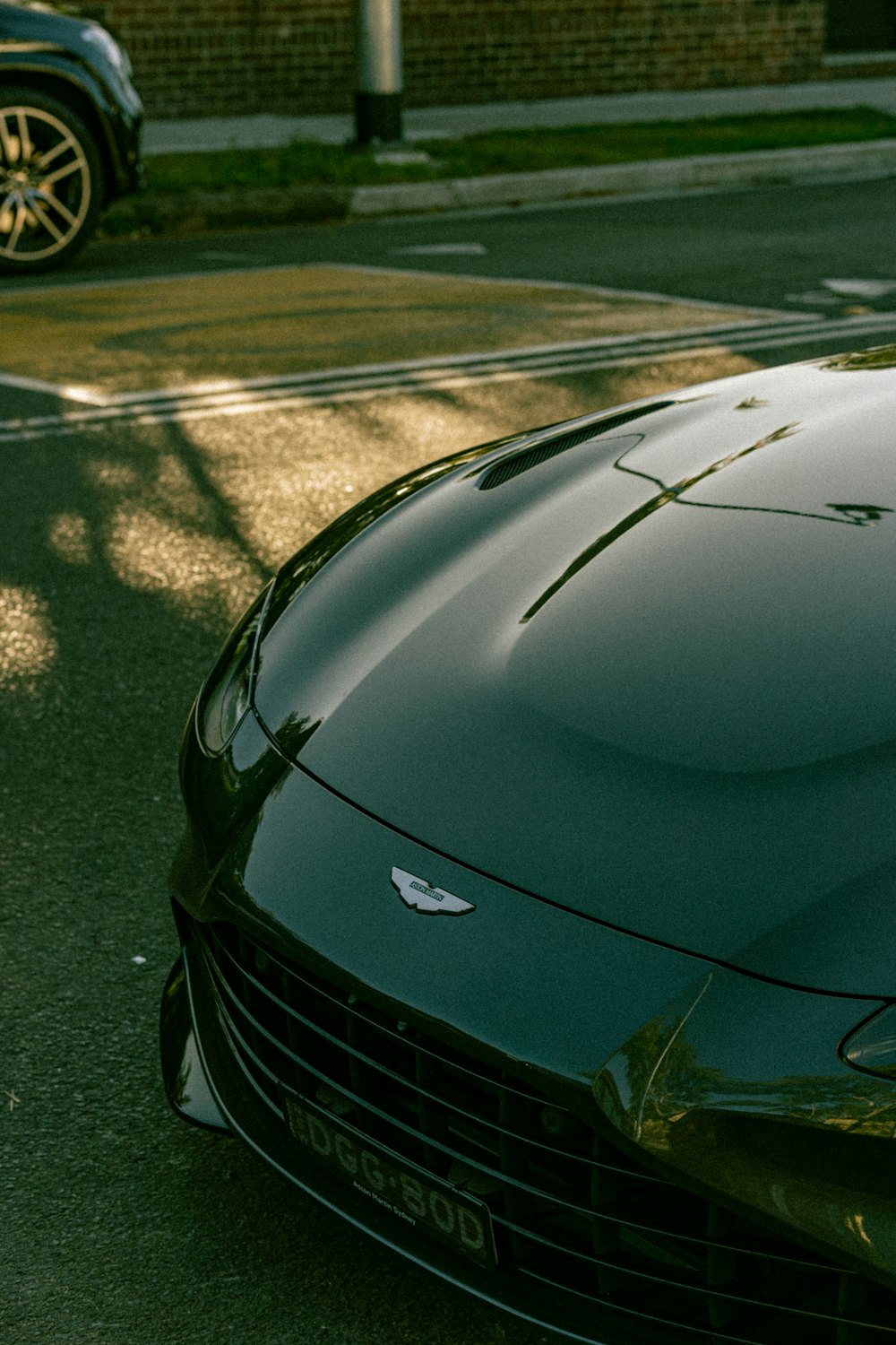 a black sports car parked on the side of the road