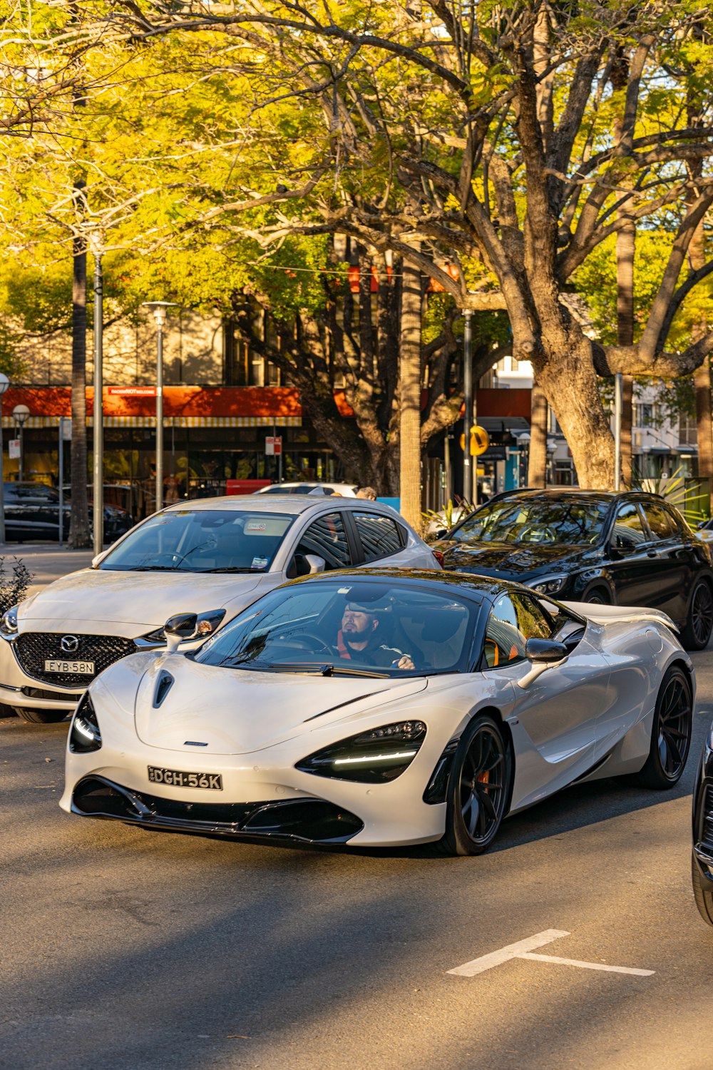 a bunch of cars that are sitting in the street