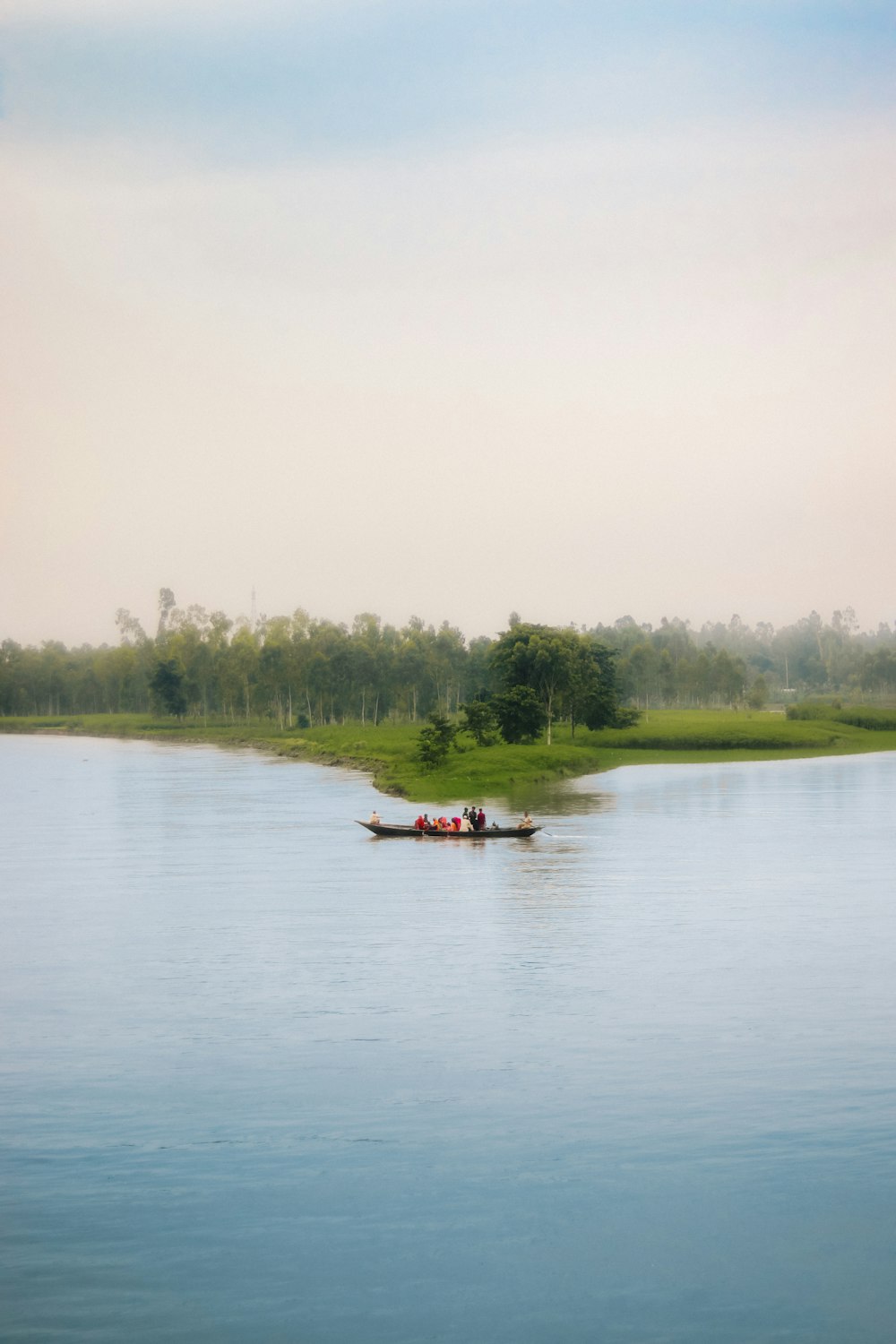 two people in a small boat on a lake