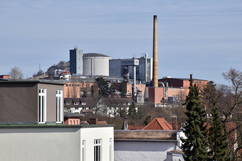 a factory with smoke stacks in the background
