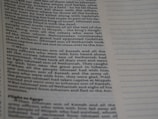 A close-up view of a page from a book, featuring text in a serif font. The words are arranged in paragraphs with a clear left margin. On the right side, there are evenly spaced dotted lines with no text.