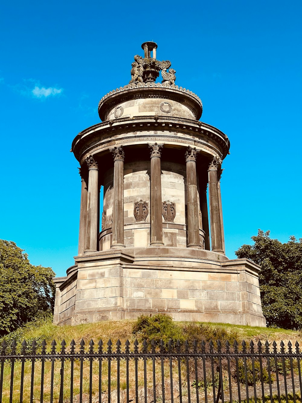 a monument with a statue on top of it