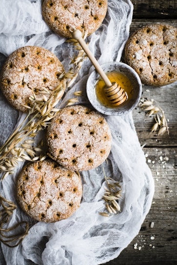 A close-up of crunchy millet biscuits arranged in a rustic bowl.