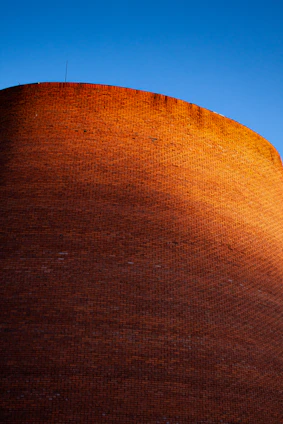 Close-up of beautifully interlocked Spanish-style bricks bathed in warm tropical sunlight.