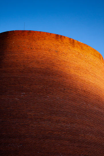 Bricklayers carefully constructing a sturdy wall on a sunny day