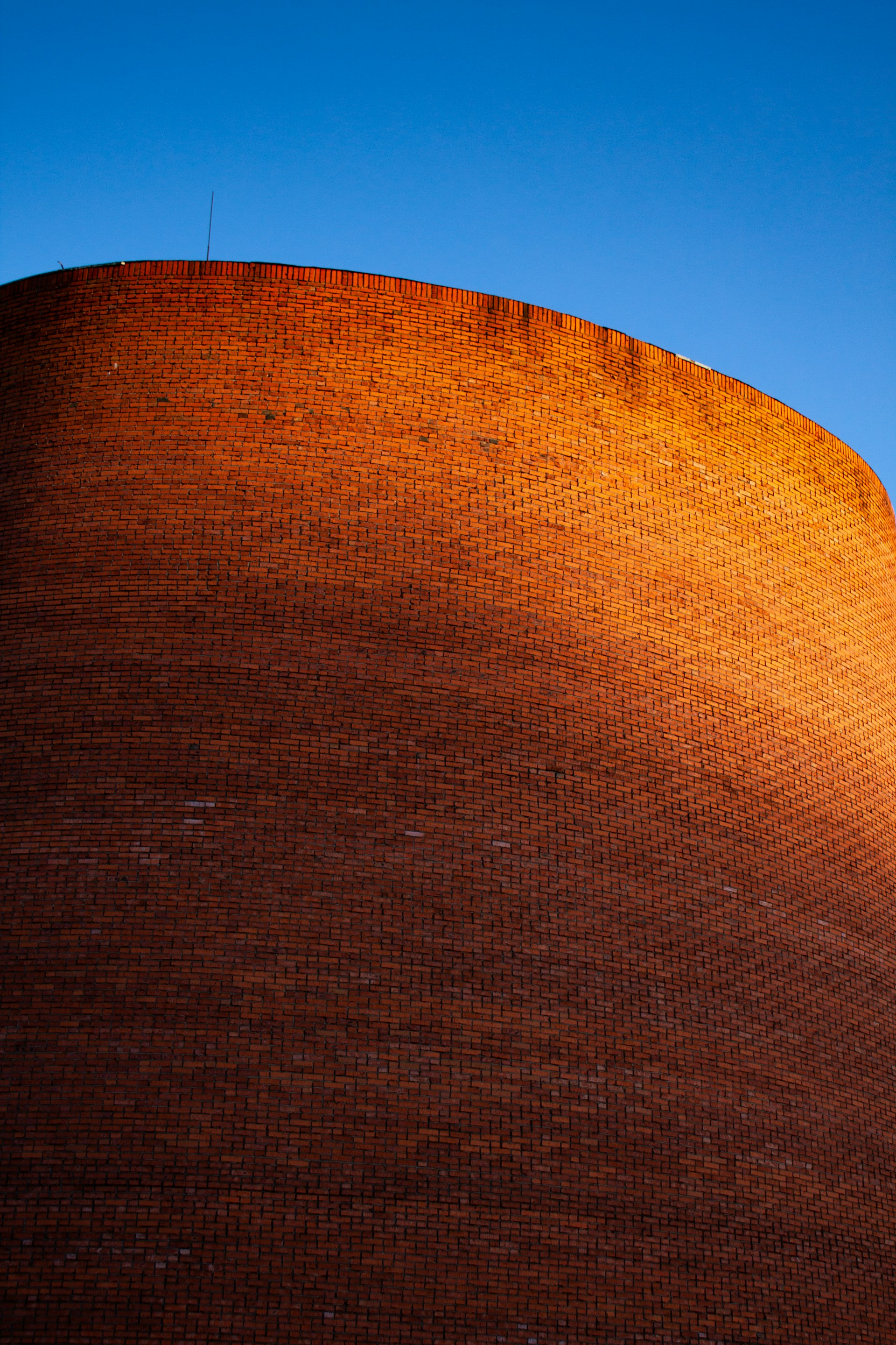 black and brown leather padded tub sofa