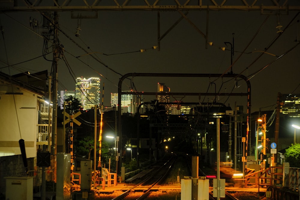 a view of a city at night from a train station