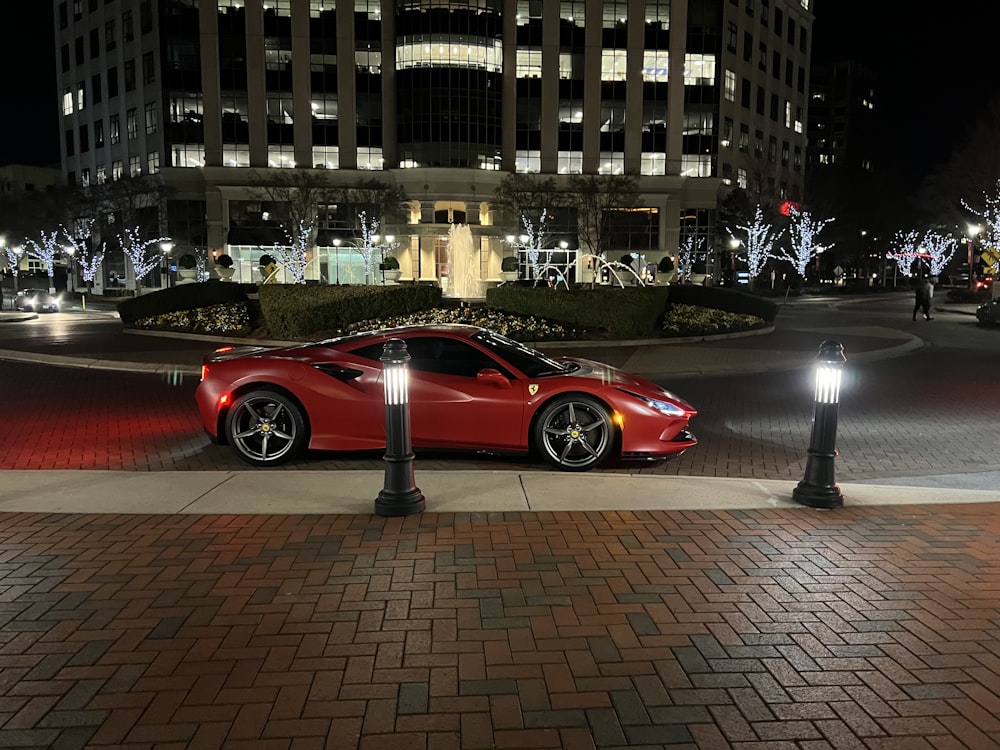 a red sports car parked on the side of the road