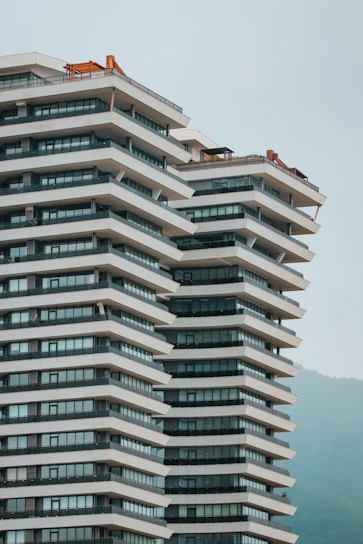 A panoramic view of the Bellissima Building in Baner, Pune, bustling with activity and showcasing modern construction.