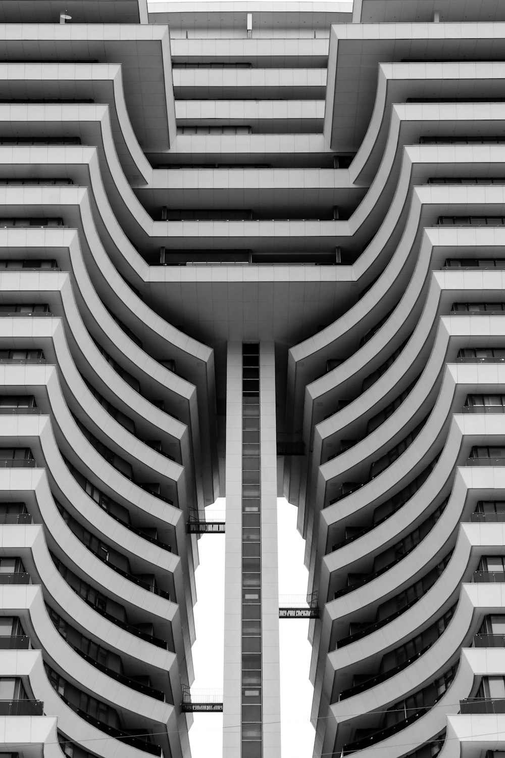 a very tall building with many balconies on it