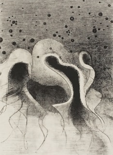 An abstract, monochromatic artwork featuring swirling, organic shapes with tendril-like extensions. Dark spots of varying sizes scatter across the upper portion, contrasting with the smooth, fluid curves in the lower half.