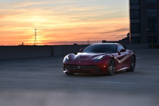 a red sports car parked in a parking lot