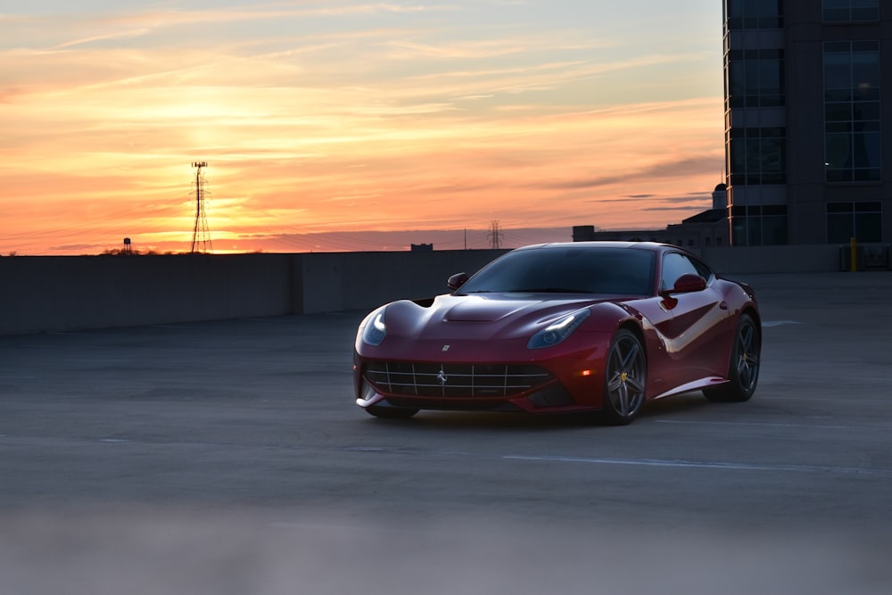 a red sports car parked in a parking lot