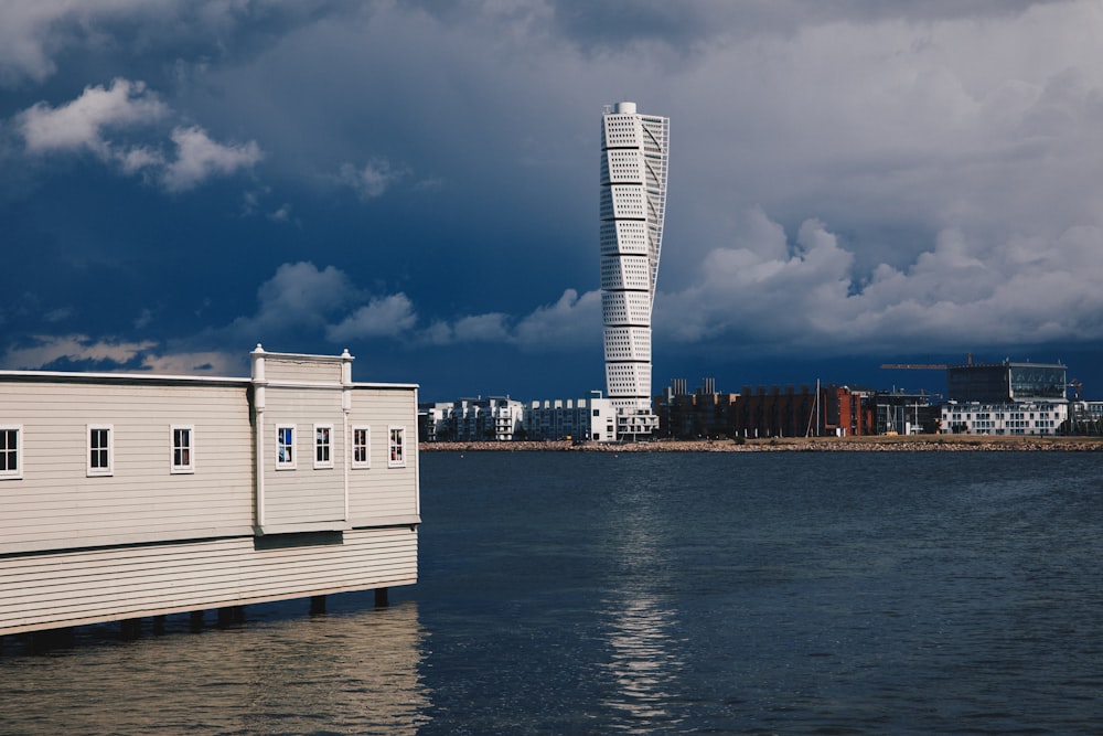 a tall building sitting on top of a body of water