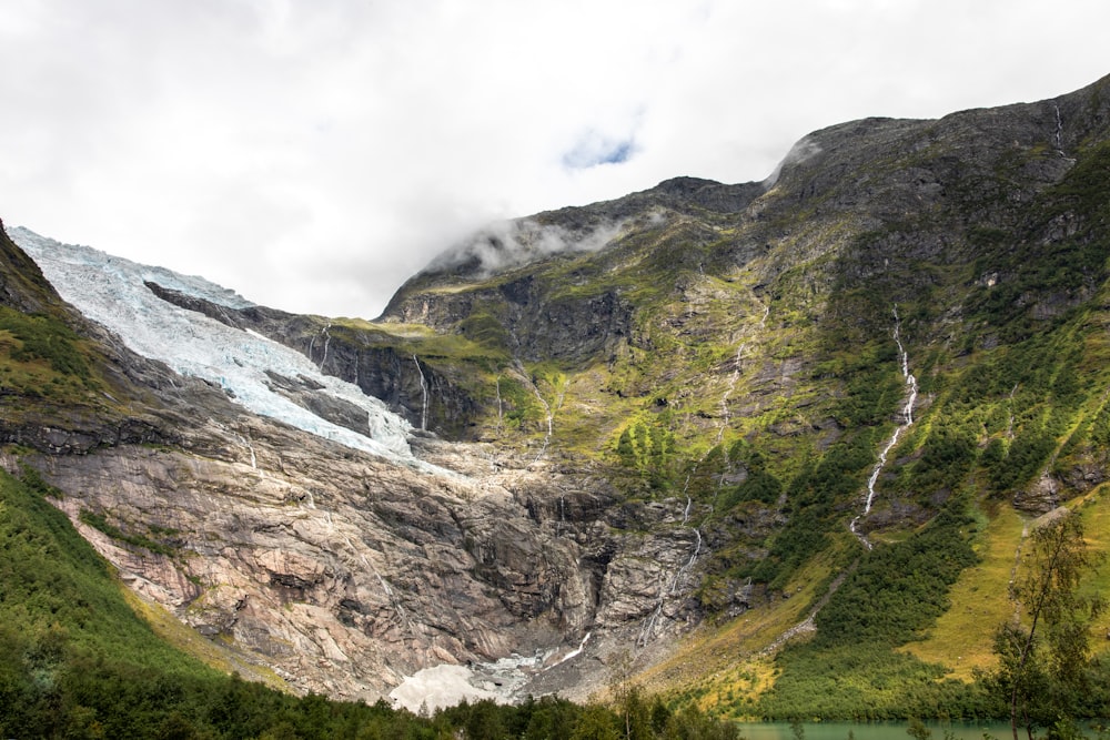 a view of a mountain with a glacier in the background