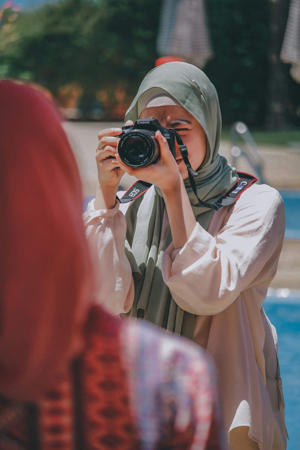 a woman taking a picture of herself with a camera