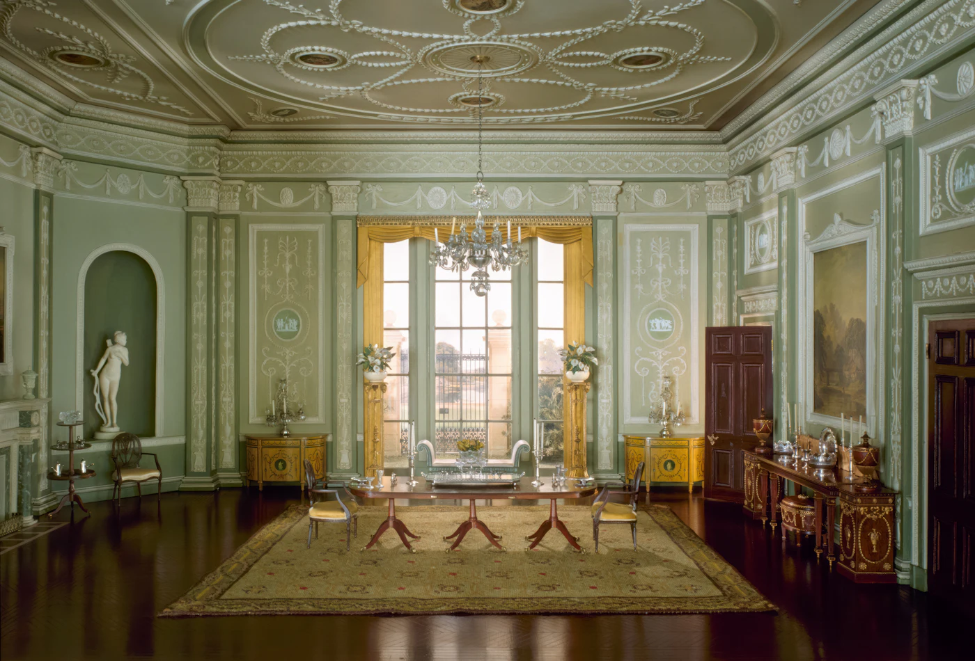 Georgian reception room with ornate plasterwork and tall windows