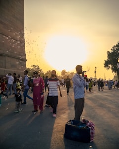 A warm sunset view of the La Rioja neighborhood with families walking and children playing.
