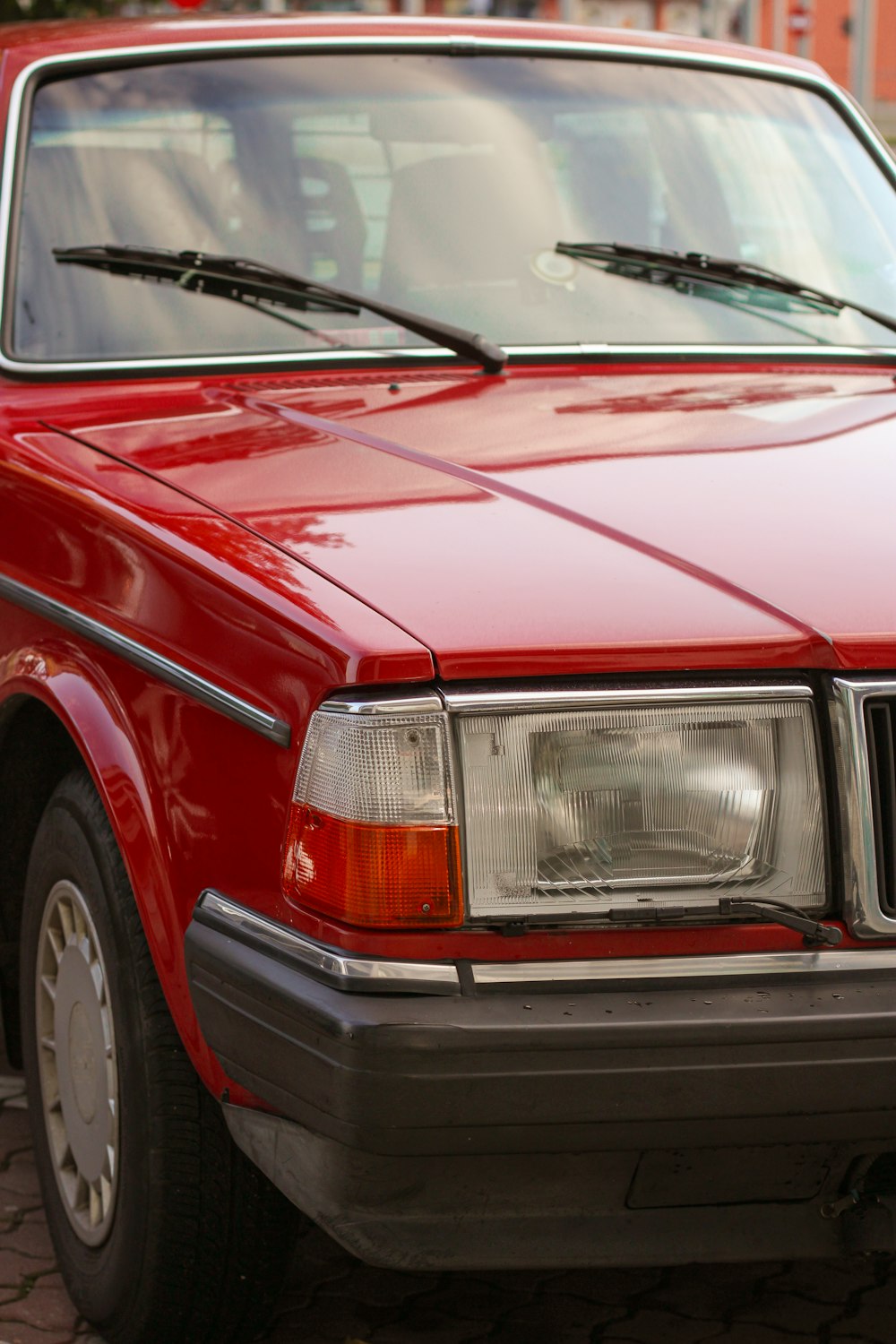 a red car parked on the side of the road