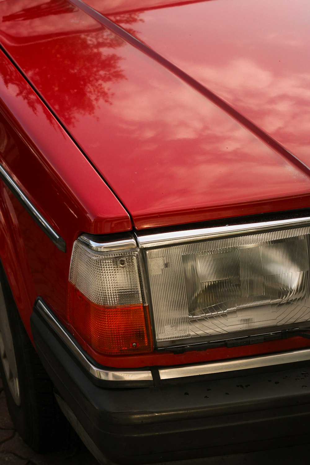 a red car parked on the side of the road