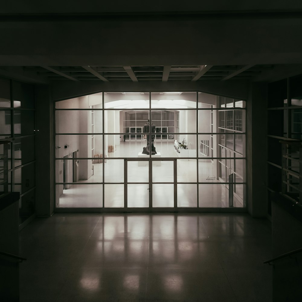 an empty room with a large glass door