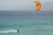 a person riding a surf board on a body of water