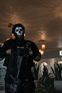 a man in a skeleton mask holding a gun