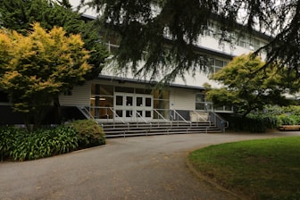 School building with welcoming entrance and greenery